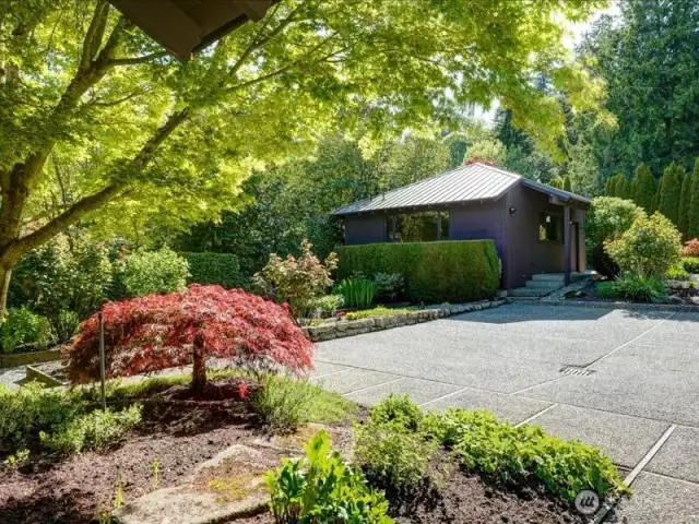 The 500 square foot detached garage is a fantastic addition to the attached two-car garage with 220V Echarger. Use the detached structure as-is or finish it for a guest house/DADU (Detached Accessory Dwelling Unit), bonus room or workshop. It features its own dedicated electrical panel, gas meter, plumbing, gas line for heat, and overhead storage.