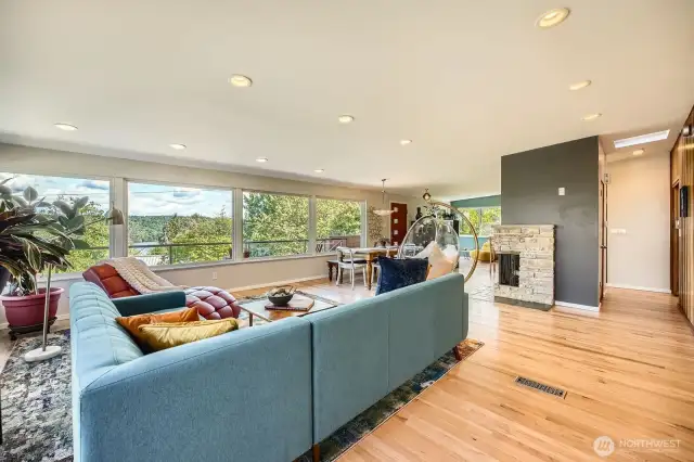 Open cpncept living space with gleaming original hard wood floors.