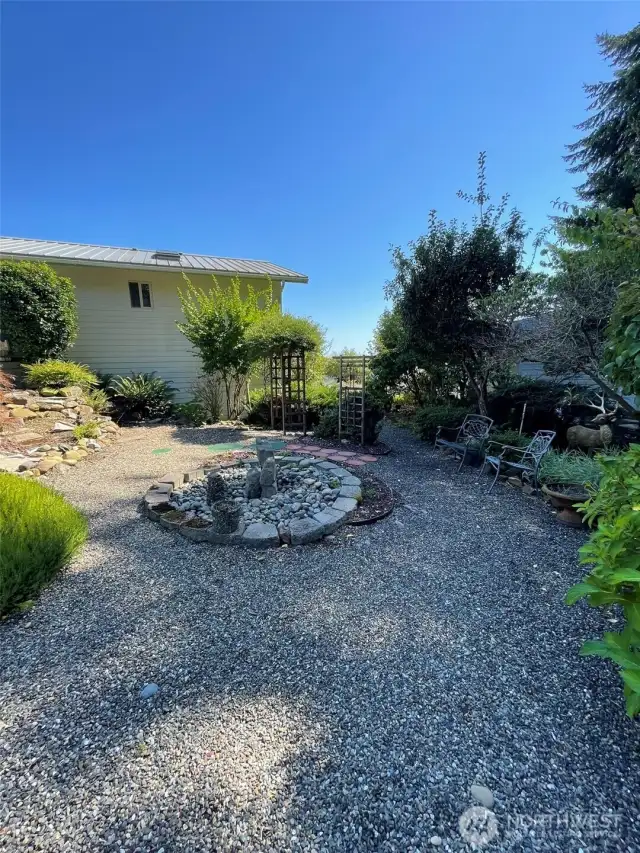 Landscaped with pond and separate water feature
