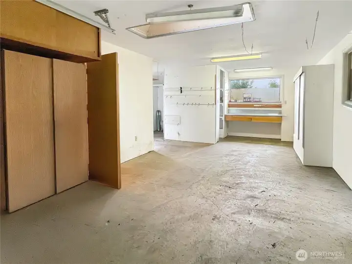 Items Virtually Removed. Detached Garage with cupboards, Shelving, Benches, and Shower Bathroom.