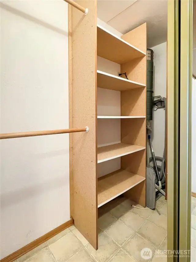 Bedroom downstairs showing central vac in closet