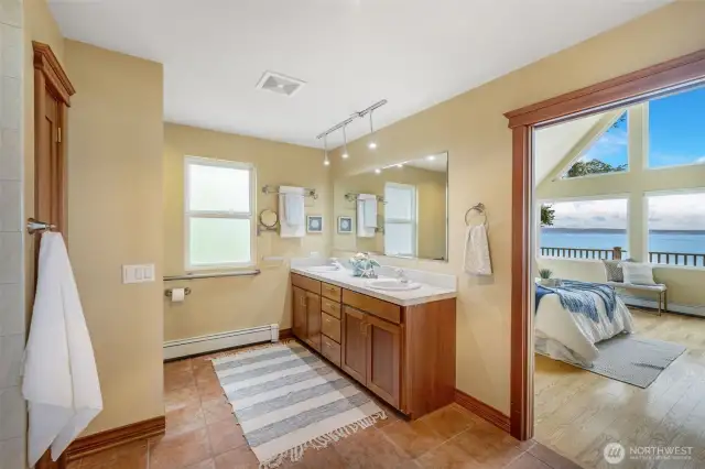 The primary bathroom connects to the primary bedroom and the main living areas with pocket doors.