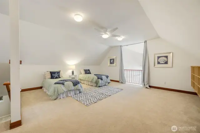 The upper level features an airy loft.
