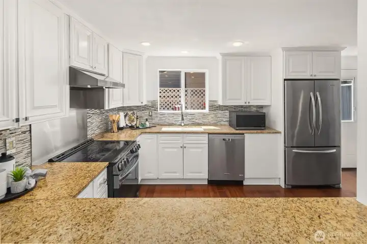 Entertaining is easy in well designed Kitchen that also features extra eating space, not shown in this photo.