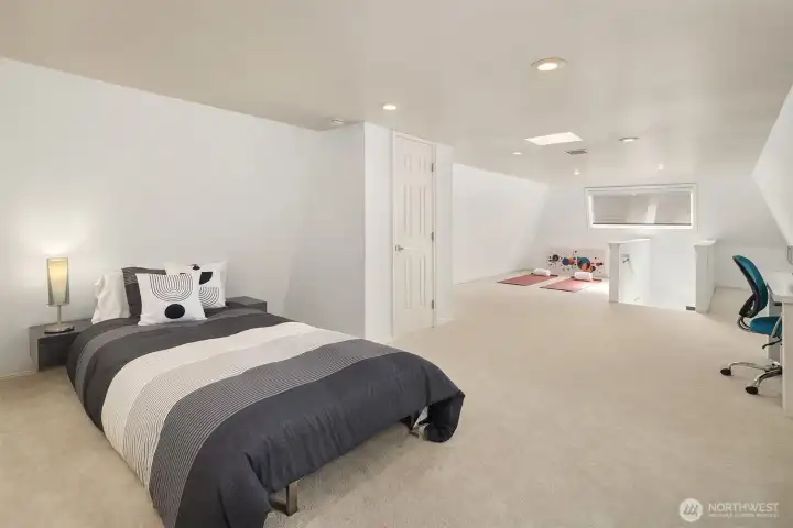 Third floor loft is a perfect 3rd Bedroom, Office and Workout area.