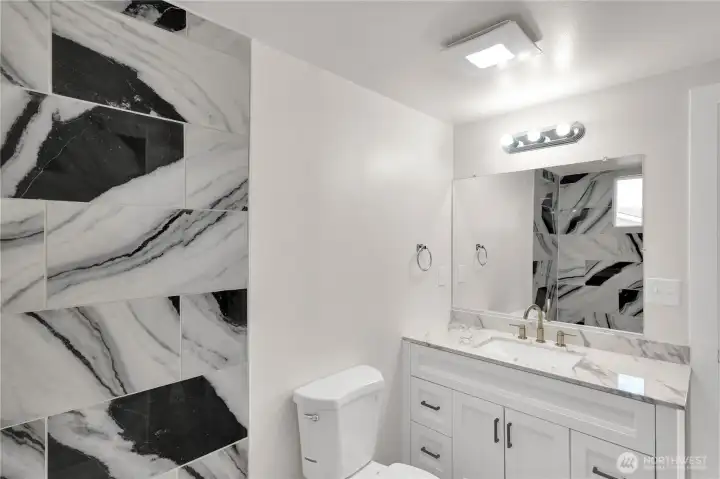 Beautifully updated vanity with plenty of counter space.