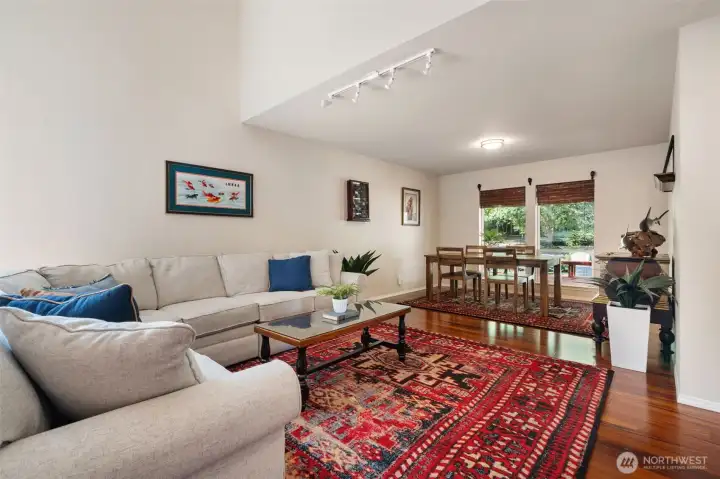 Living room looking toward dining room and backyard beyond.