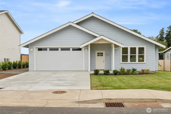 This brand new home has amazing curb appeal and is situated in such a lovely development along the shores of Drayton Harbor.