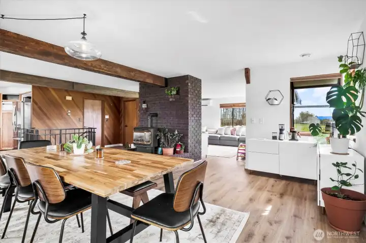 Seamlessly flow from the table, to a coffee nook, to the living space, all surrounded by windows.
