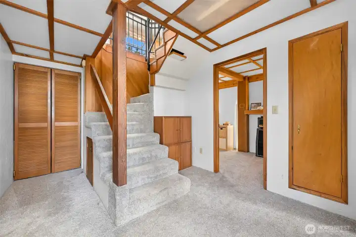 Enter your daylight basement through the spiral staircase