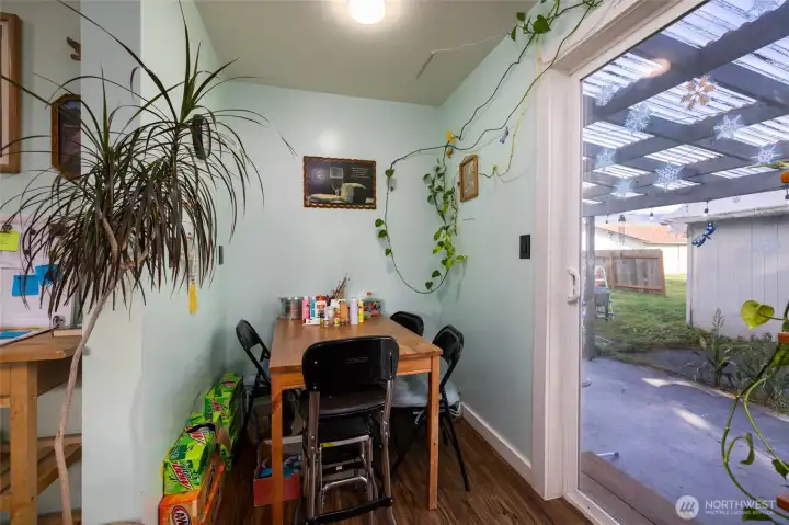 Dining nook off the kitchen leads to the covered patio