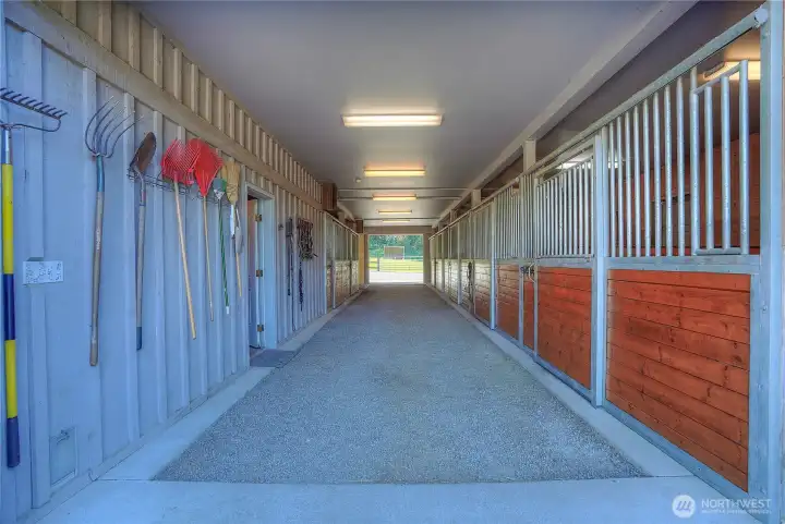 Looking from opposite end of barn down the 12 X 60 center aisle. The five stalls on the right (west side) have direct turn out.