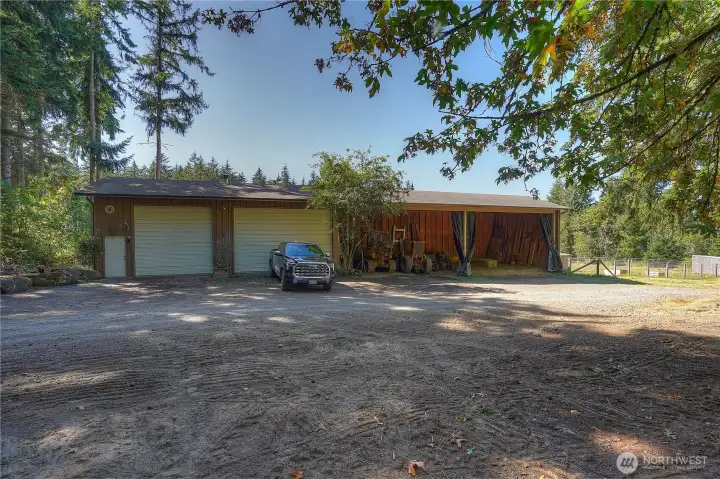 24 X 100 conventional wood construction hay barn/equipment/garage/workshop with foundation. 24 X 60 X 16 hay/equipment storage - plenty of room for 30 tons of hay!  24 x 40 X 13.4 garage/workshop concrete floors. one door is 12 X 11'7" and one door is 18 X 11'7" + wired for welding and air compressor.