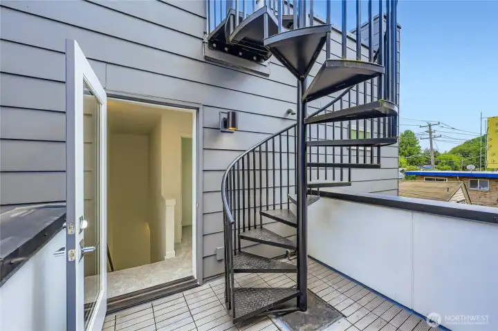Spiral staircase to large rooftop deck