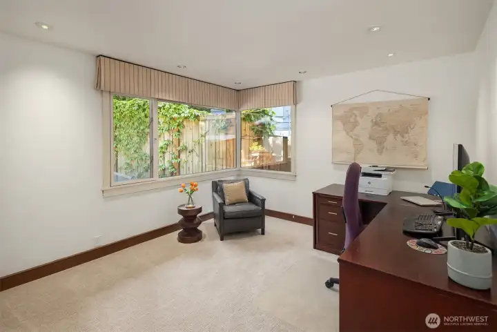 An additional bedroom and a dedicated office complete the main level, making work-from-home days a breeze.