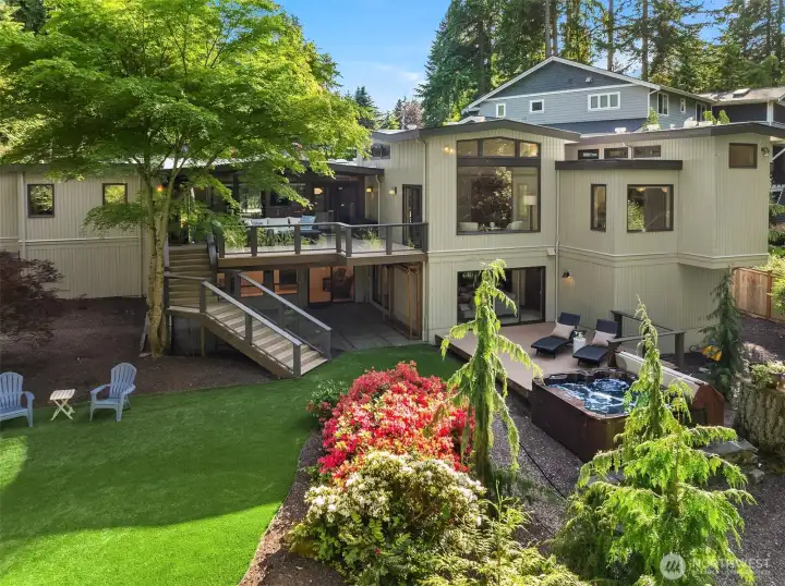 Enjoy sun-drenched afternoons on your front garden deck & host unforgettable family gatherings on the expansive back deck. Not photographed is the private fire pit at the lower garden level.