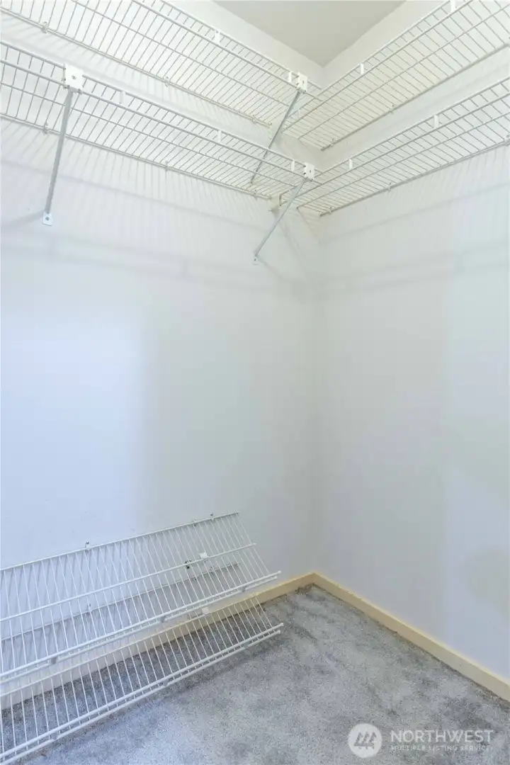 Walk-in closet space in primary bedroom