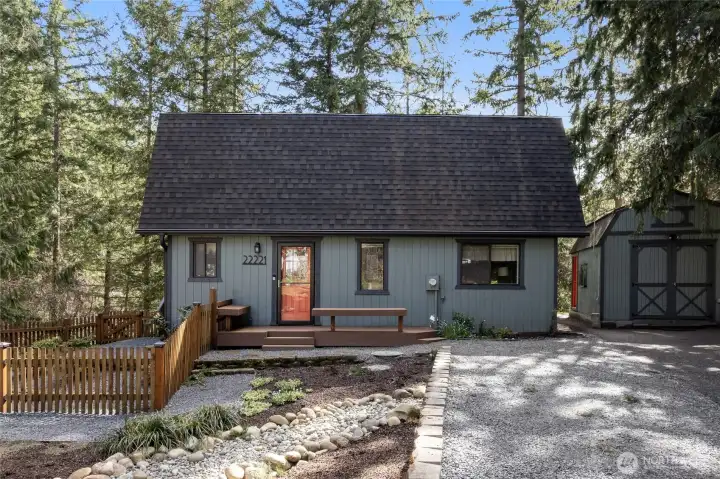 Stunning cottage in a scenic backdrop with  lush trees and water views