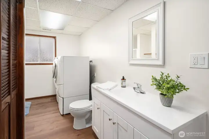 Utility room and half bath with shower.