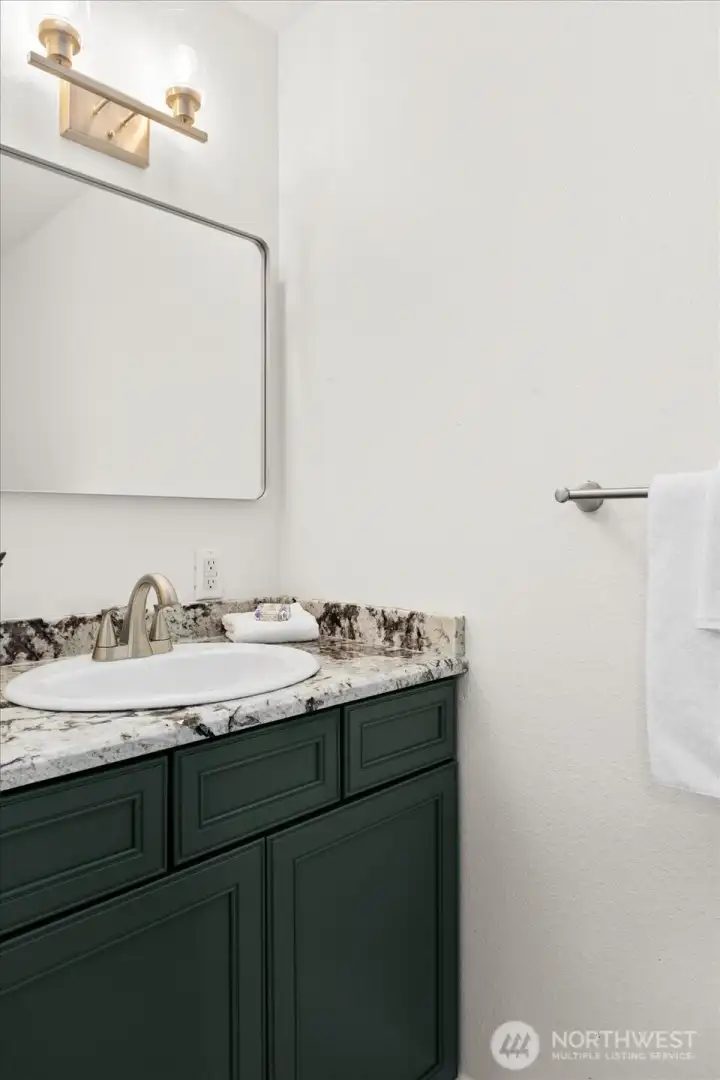 Primary half bath with updated vanity