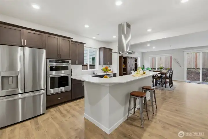 This is the kitchen that everyone wants - open, lots of quartz counterspace and cabinetry adjoining a dining room and great room.