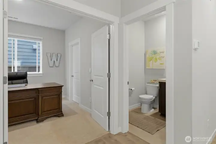 Double doors into office, then the 3/4 bathroom is right next to it.  Convenient!