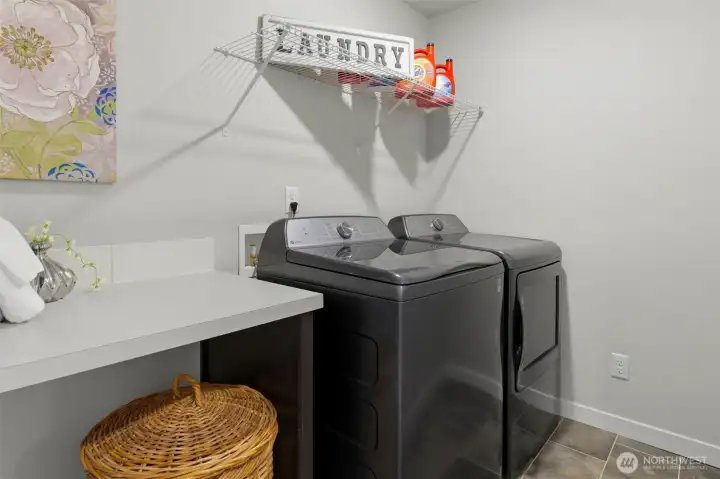 Laundry room with folding counter.