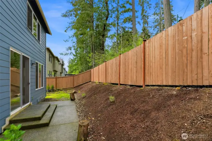 Backyard, fully fenced. side yard is level.
