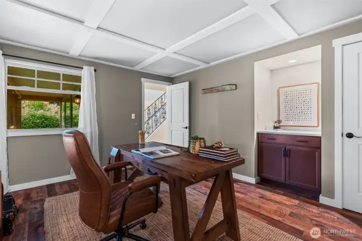 office off entry with custom ceiling treatment and bar area