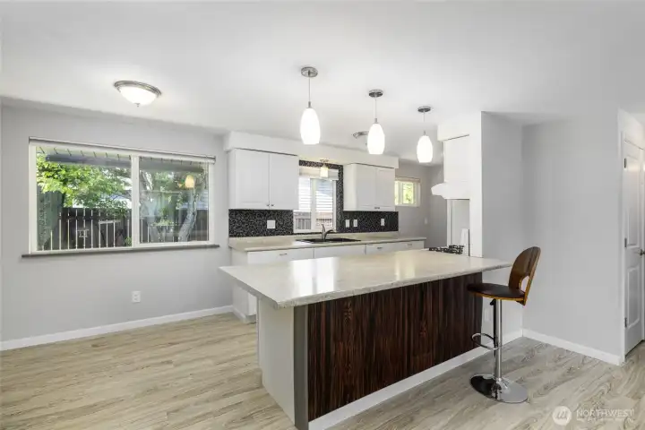 Kitchen has been updated and is open to the living room and dining room.