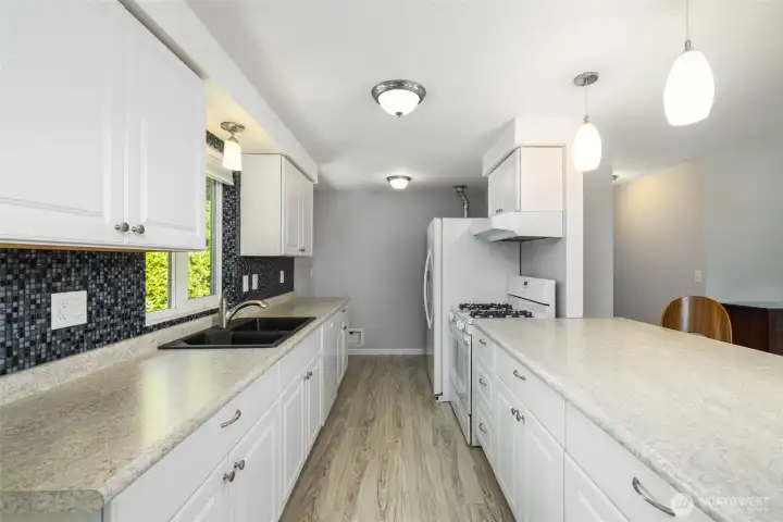 Lots of counter space with tile backsplash