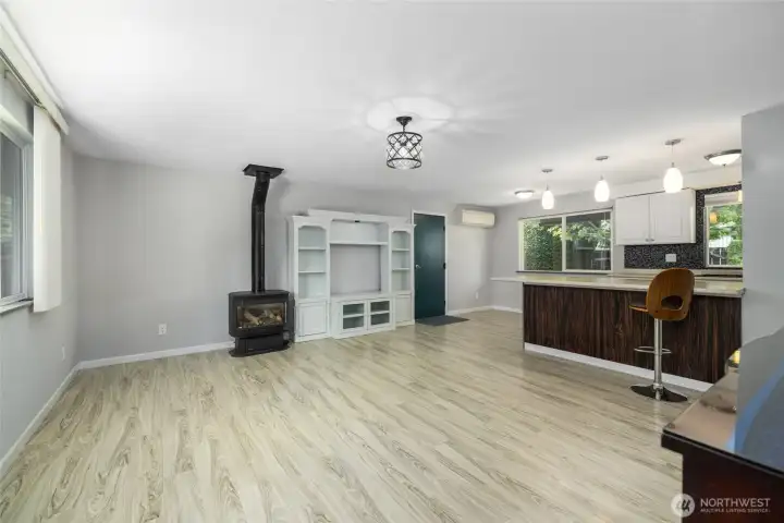 Quadra Fire Gas stove gives off good heat with a glass front to view the flames.  Wall unit can stay.