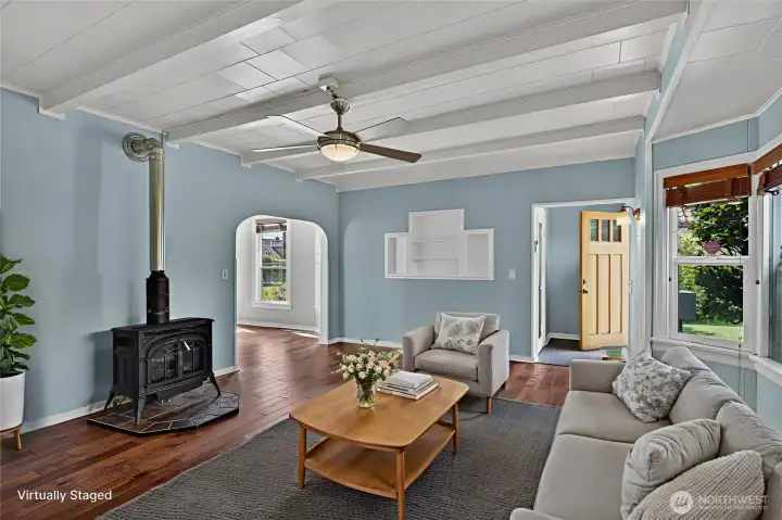 Virtually staged living room with original built-ins and curved archways. Virtually staged living room with original built-ins and curved archways.