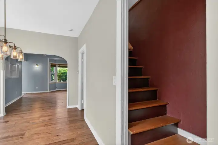 Staircase from the dining area leading to 4 bedrooms and a full bathroom. Staircase from the dining area leading to 4 bedrooms and a full bathroom.