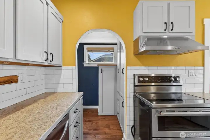From the kitchen leads extra storage and a 3/4 bathroom. From the kitchen leads extra storage and a 3/4 bathroom.