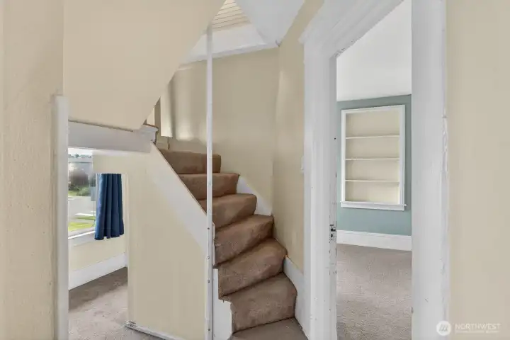 Comfy, cozy, an fun: this staircase sits above a reading/play nook leading to two more additional bedrooms. Comfy, cozy, an fun: this staircase sits above a reading/play nook leading to two more additional bedrooms.