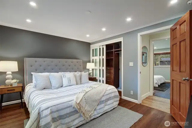 Retreat to your spacious primary suite with built-in closet organizer. (king size bed shown)