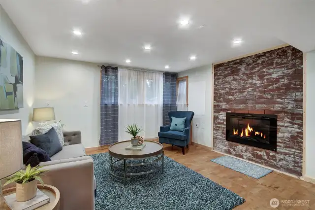 Soundproofed den/rec room with fireplace is perfect for music or movie nights.