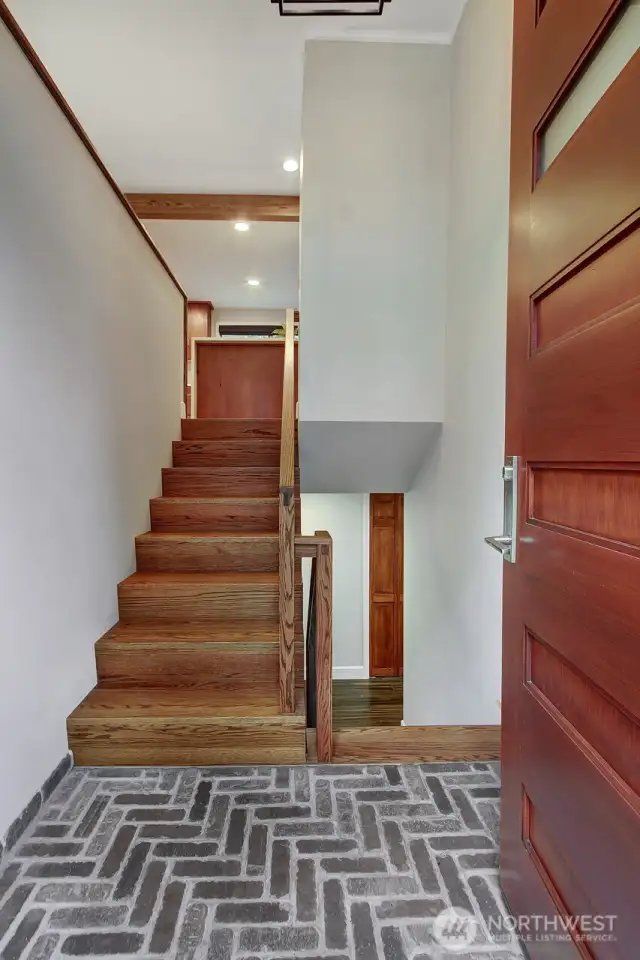 Brick entryway & genuine oak staircase welcome you in.