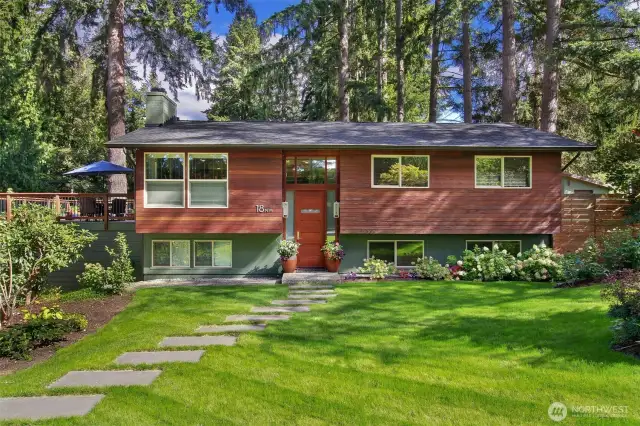 Exotic Cumaru hardwood rain screen siding was installed in 2018.