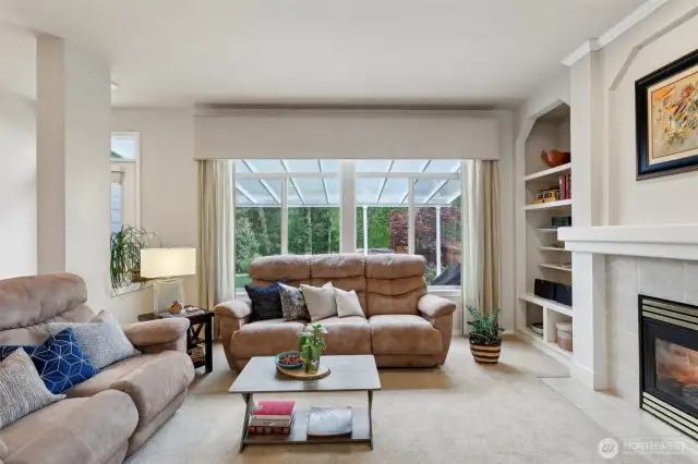 Family Room showing off its gas fireplace and sliding door to back yard