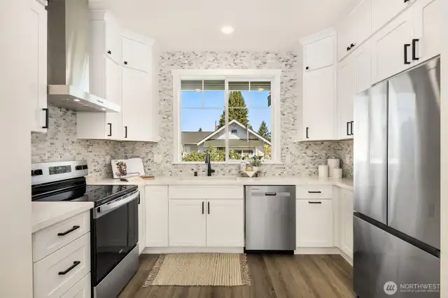 Spacious kitchen with ample counter and storage space.