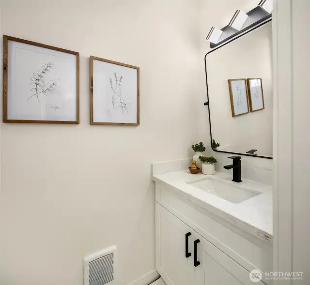 Powder room on main floor off of foyer.