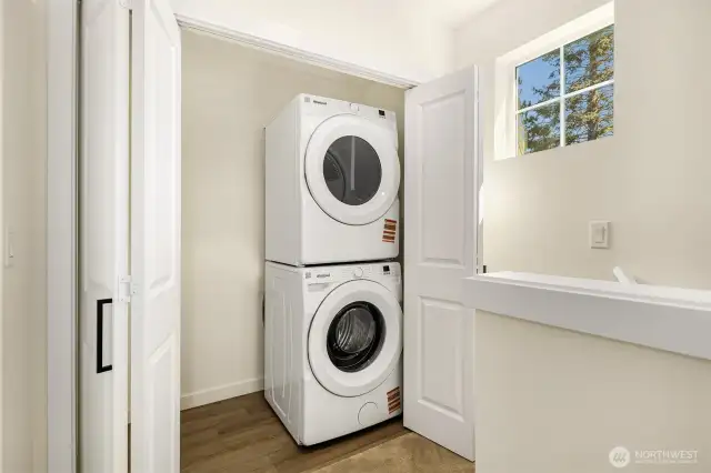 Washer & dryer set up off of upstairs landing.