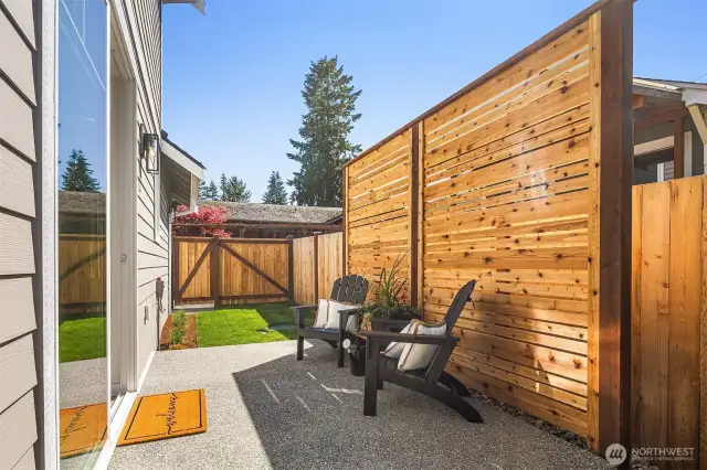 Outdoor patio with fence adding additional privacy.