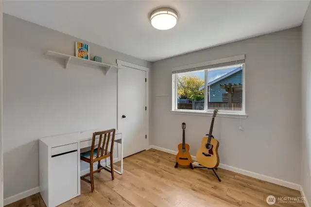 Second bedroom with views onto the side yard.