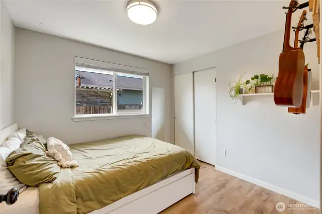 Third bedroom with views onto the side yard. Light and bright!