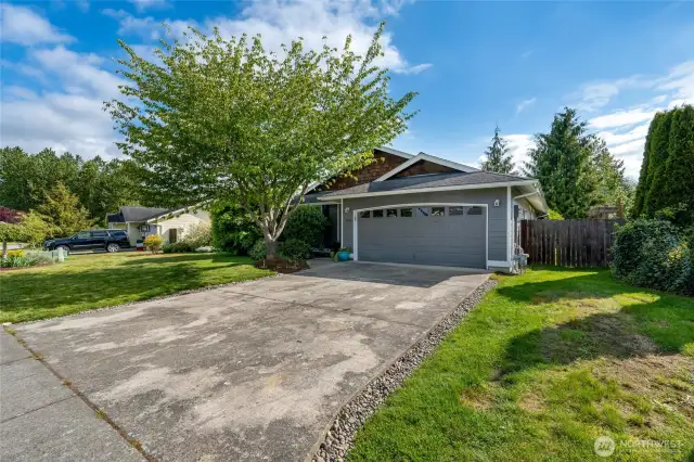 Mature landscaping graces the lovely front and back yards.