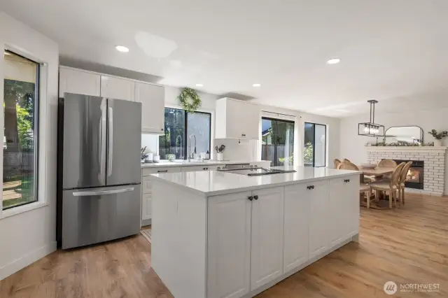 Renovated kitchen with Stainless Steel appliances, Quartz Countertops, and Hardwood floors