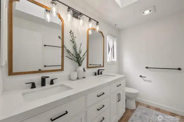 Tastefully updated Primary Ensuite with dual sinks and frameless glass shower.